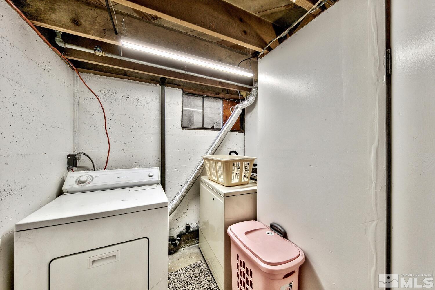561 Moran Street Reno, NV 89502 - Photo 22 of 40 a bathroom with a sink a toilet and mirror
