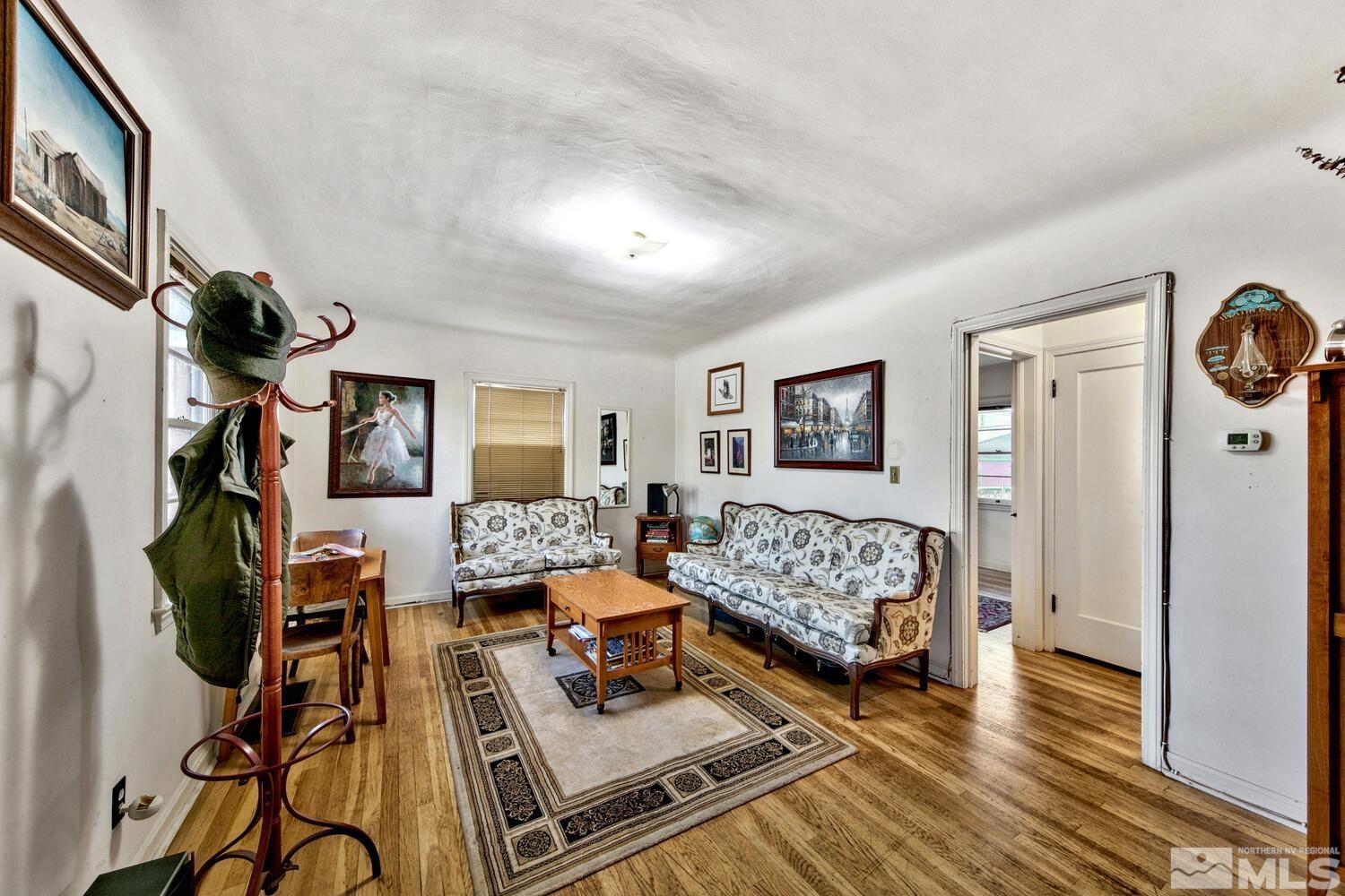 561 Moran Street Reno, NV 89502 - Photo 4 of 40 a bedroom with furniture and a wooden floor