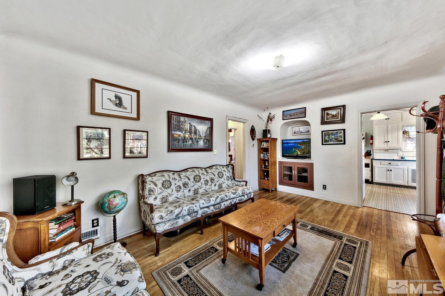 561 Moran Street Reno, NV 89502 - Photo 5 of 40 a living room with furniture a rug and a flat screen tv