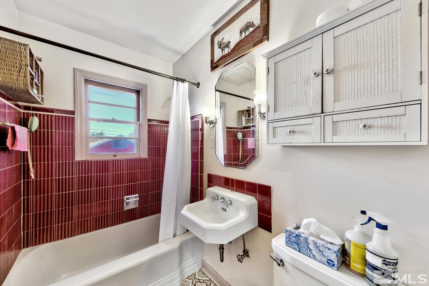 561 Moran Street Reno, NV 89502 - Photo 10 of 40 a bathroom with a sink a toilet and shower
