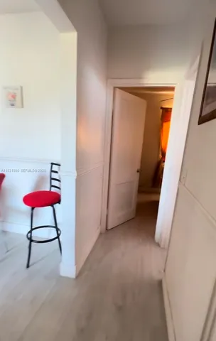 a view of room with furniture and wooden floor