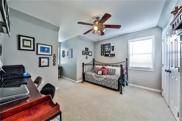 a bedroom with furniture and a window