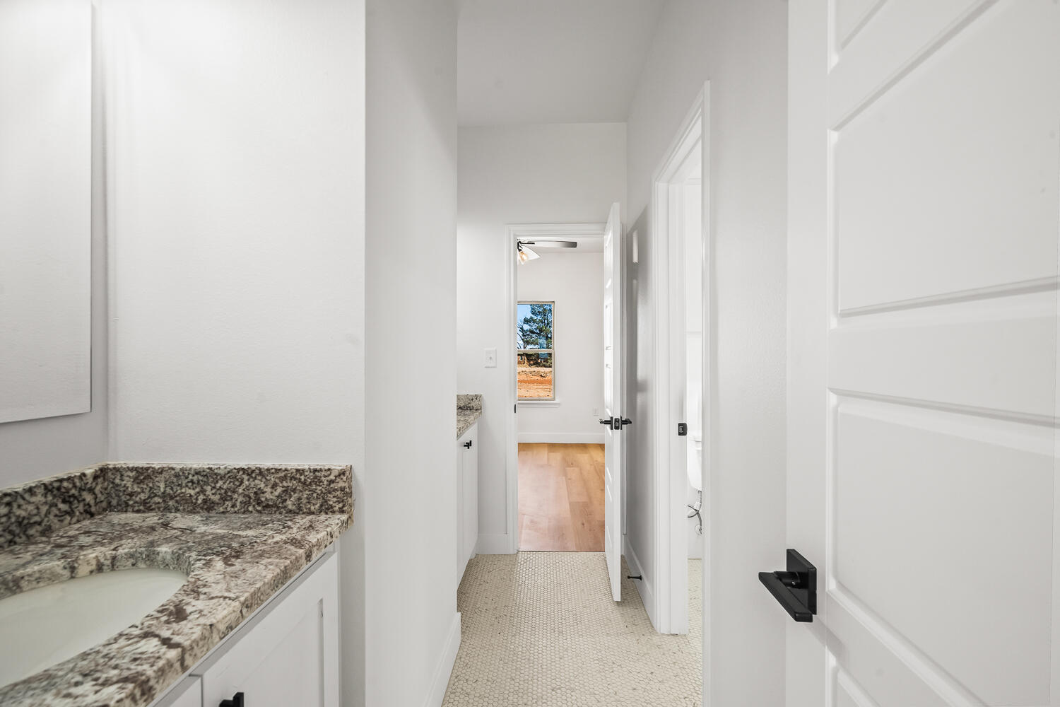 4062 Hawk Road Ropesville, TX 79358 - Photo 25 of 45 a bathroom with a granite countertop sink and mirror