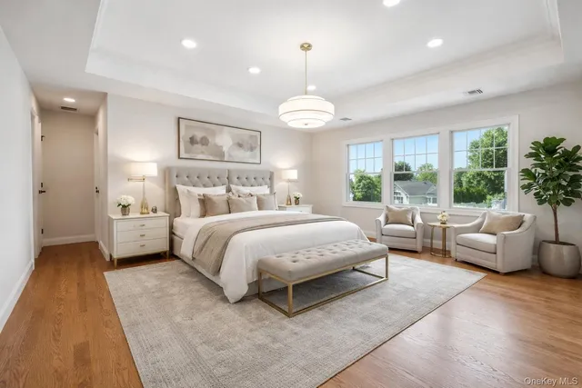 a spacious bedroom with a bed and a couch