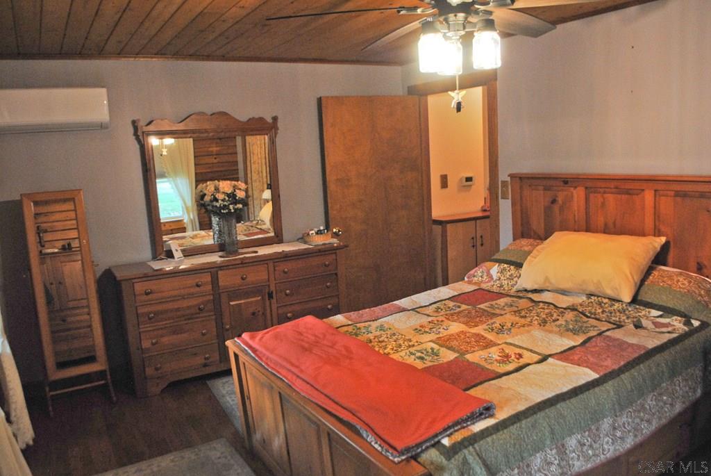 605 Griffith Road Seward, PA 15954 - Photo 26 of 45 a bedroom with a bed and a dresser in it