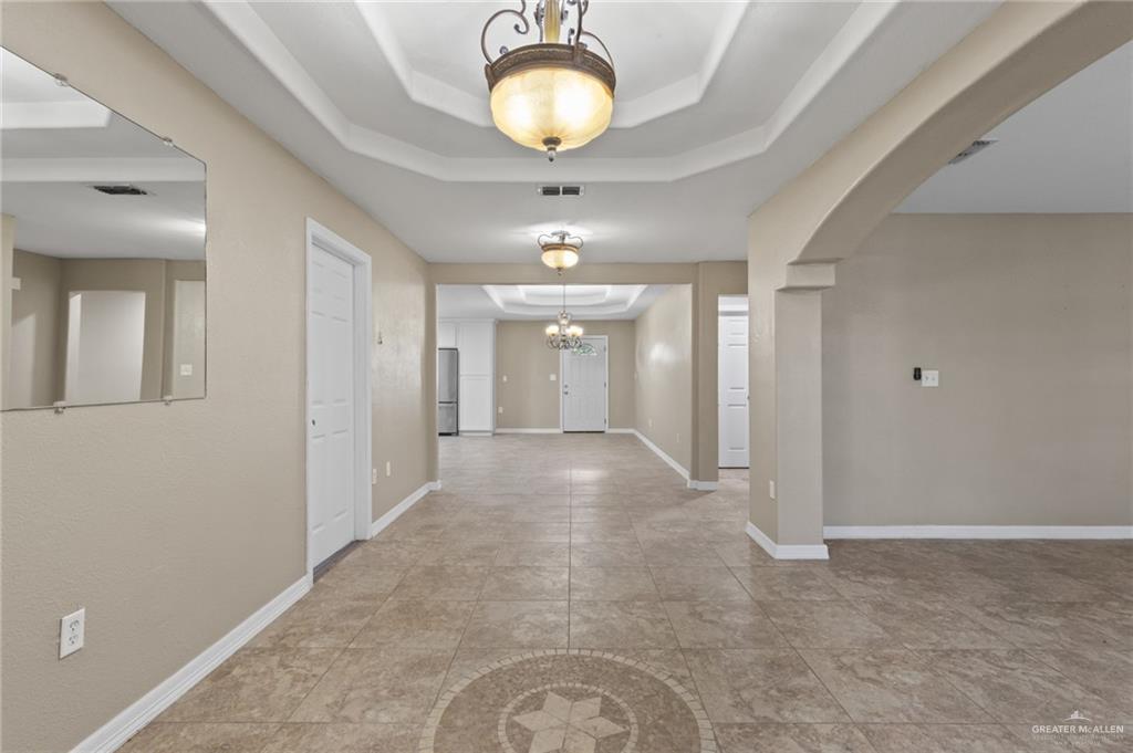 8006 Senecio Street Mission, TX 78574 - Photo 3 of 20 a view of a livingroom with a chandelier
