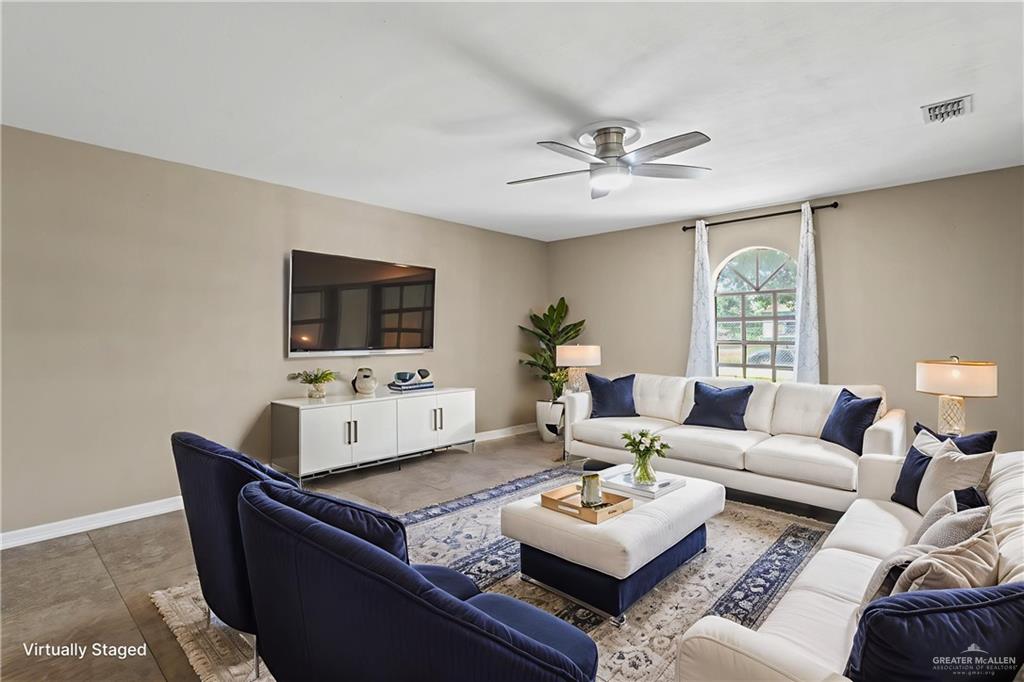 8006 Senecio Street Mission, TX 78574 - Photo 6 of 20 a living room with furniture and a flat screen tv