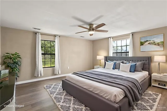 a bedroom with a large bed and a window