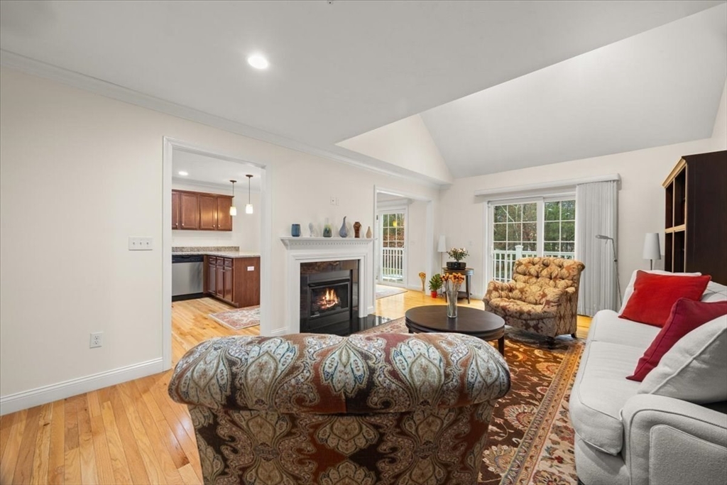 22 Highland Road, Unit 29 Raynham, MA 02767 - Photo 11 of 36 a bed room with a bed and a fireplace