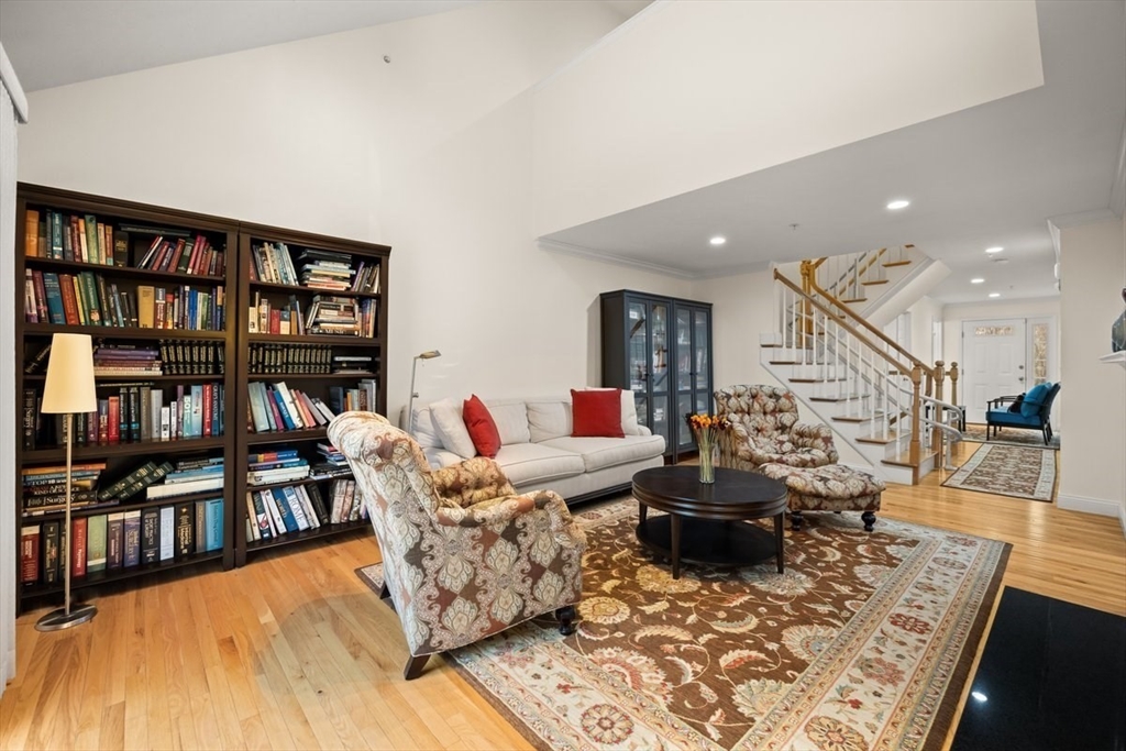 22 Highland Road, Unit 29 Raynham, MA 02767 - Photo 12 of 36 a living room with furniture and a book shelf