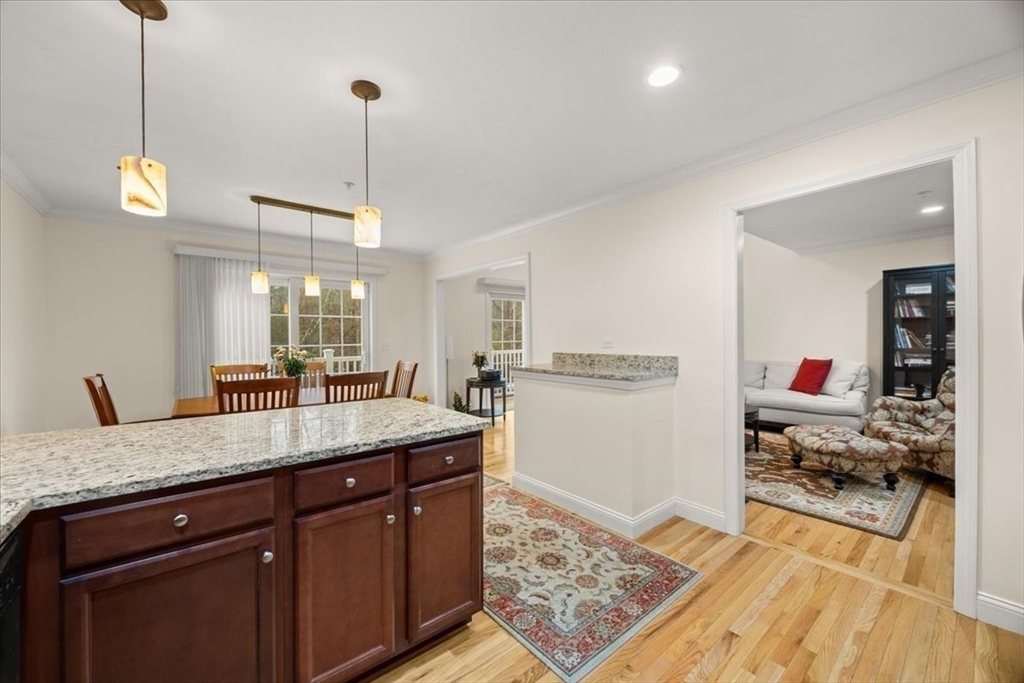 22 Highland Road, Unit 29 Raynham, MA 02767 - Photo 19 of 36 a kitchen with counter top space and wooden floor