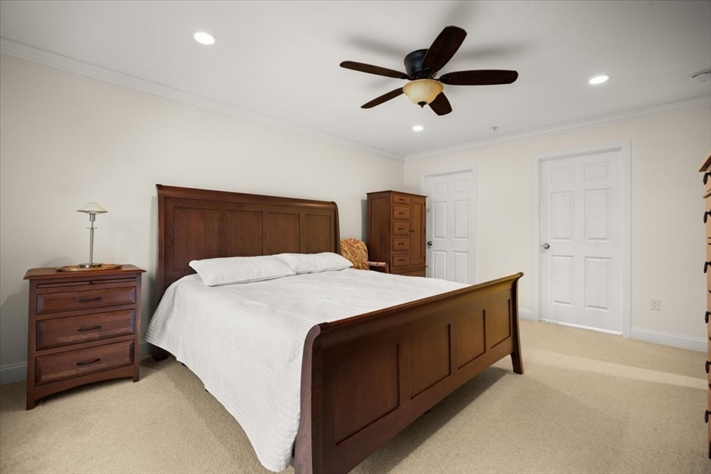 22 Highland Road, Unit 29 Raynham, MA 02767 - Photo 25 of 36 a bedroom with a bed and a dresser