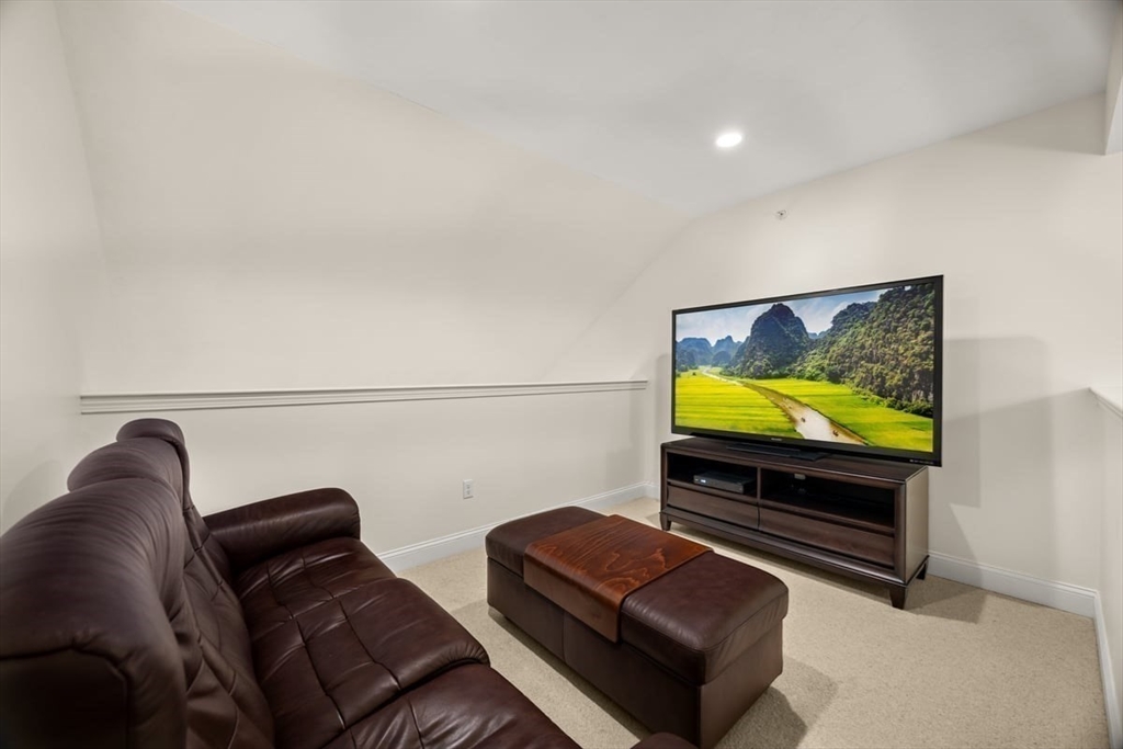 22 Highland Road, Unit 29 Raynham, MA 02767 - Photo 28 of 36 a living room with furniture and a flat screen tv