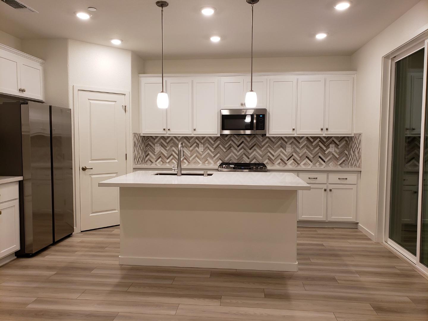 3433 Cantor Drive Folsom, CA 95630 - Photo 16 of 18 a view of kitchen with white cabinets