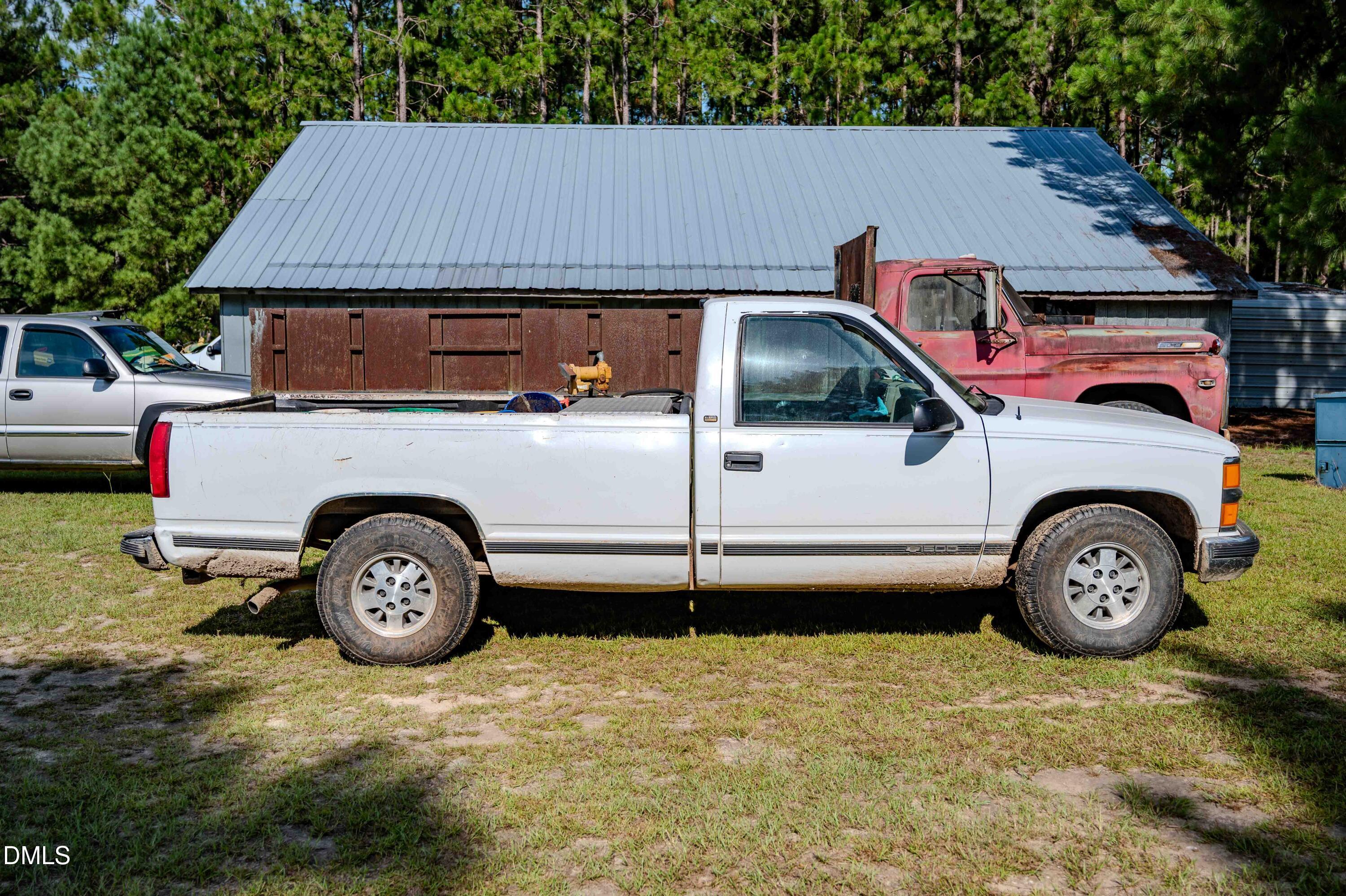 687 Brock Road Bunnlevel, NC 28323 - Photo 20 of 68 a car parked in front of a house
