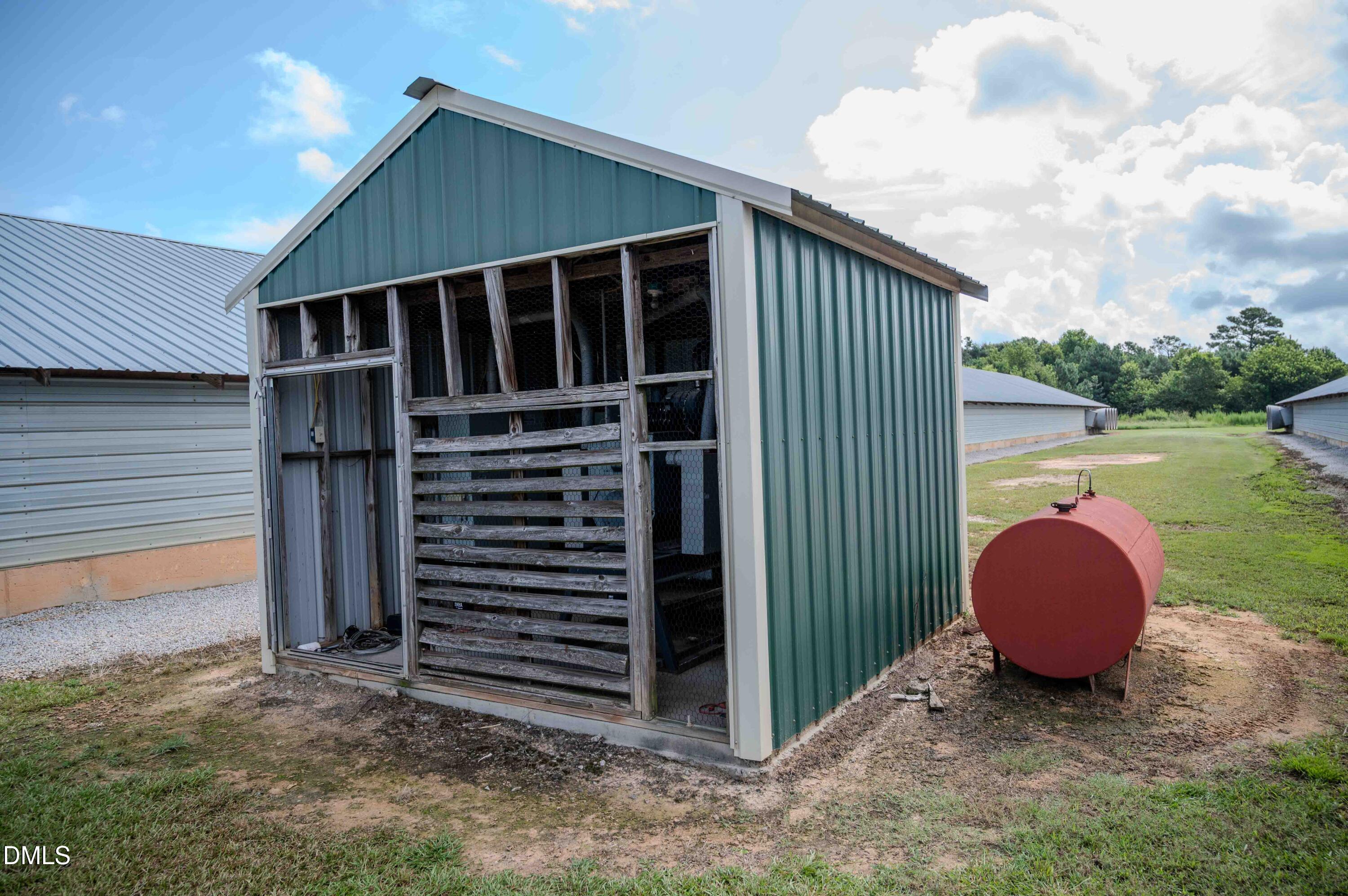 687 Brock Road Bunnlevel, NC 28323 - Photo 31 of 68 a view of a house with backyard and wooden fence