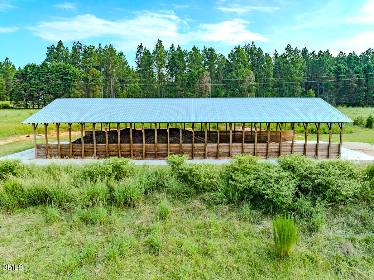 687 Brock Road Bunnlevel, NC 28323 - Photo 48 of 68 a view of a house with pool and a yard