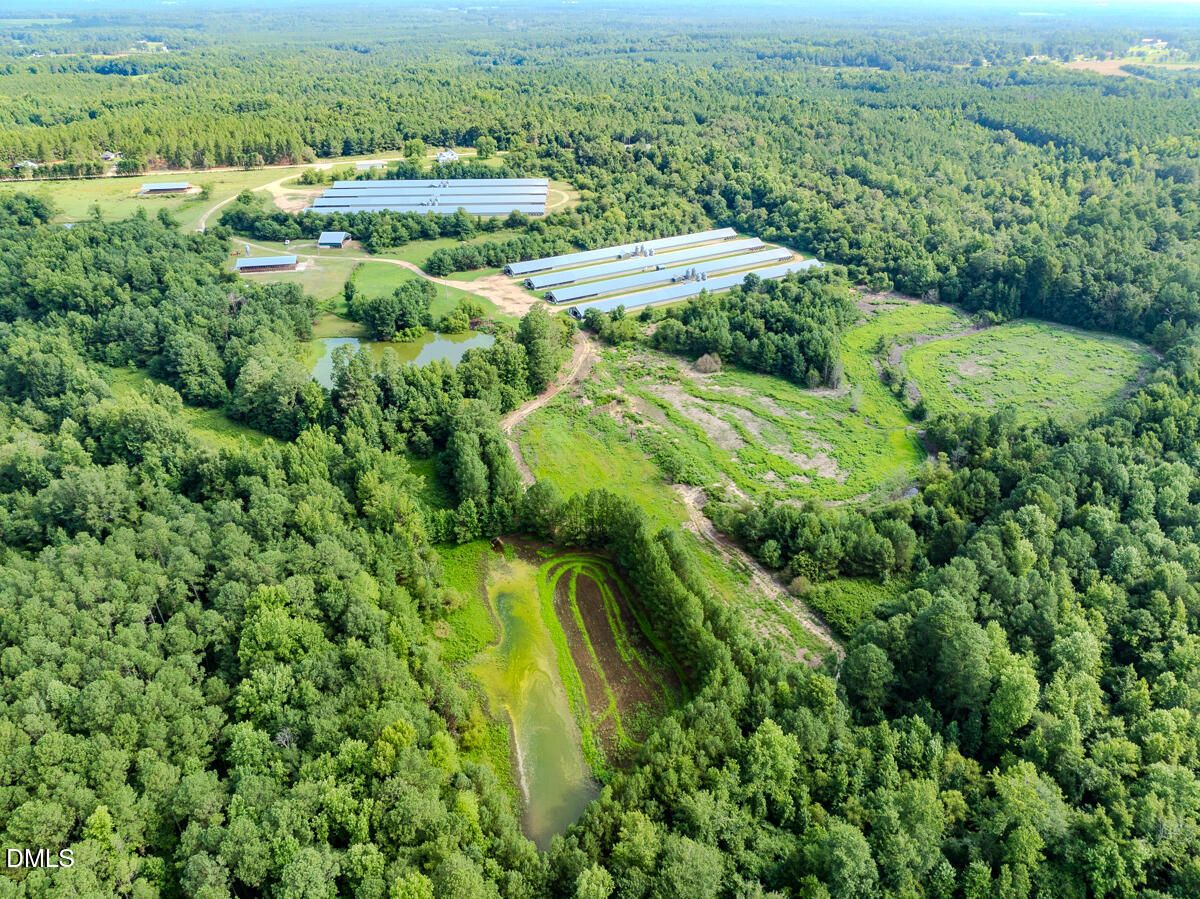 687 Brock Road Bunnlevel, NC 28323 - Photo 52 of 68 an aerial view of residential houses with outdoor space and trees