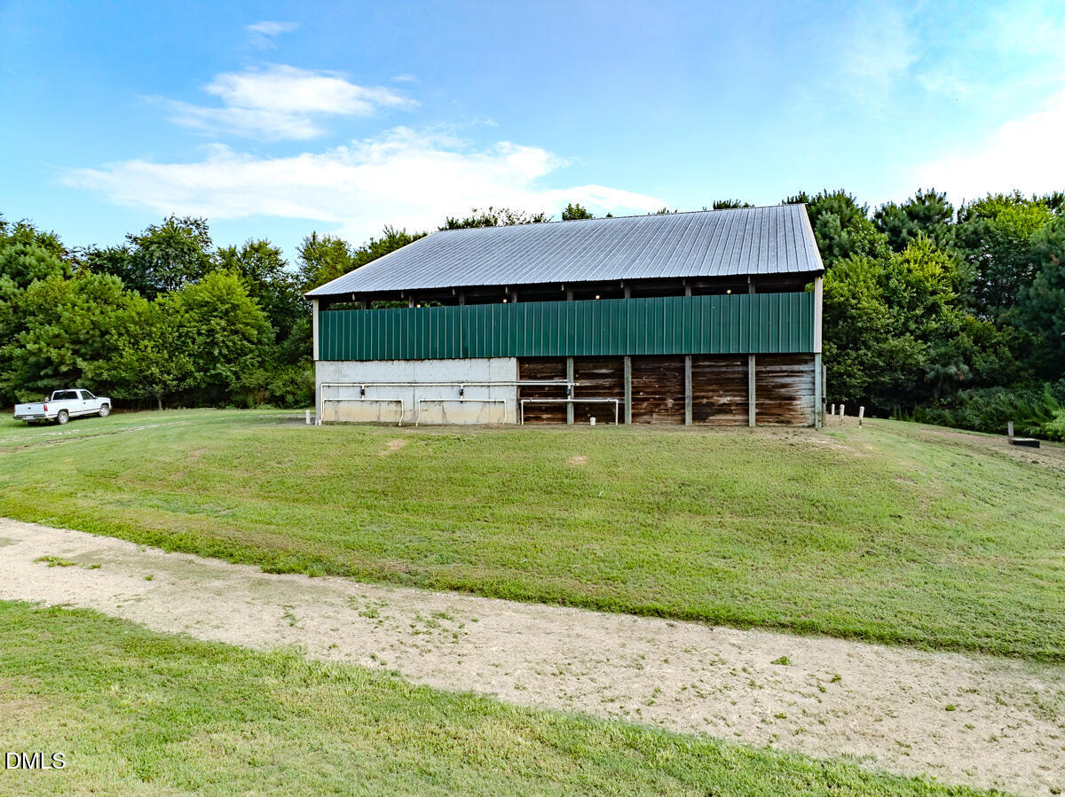 687 Brock Road Bunnlevel, NC 28323 - Photo 55 of 68 a front view of a house with a garden