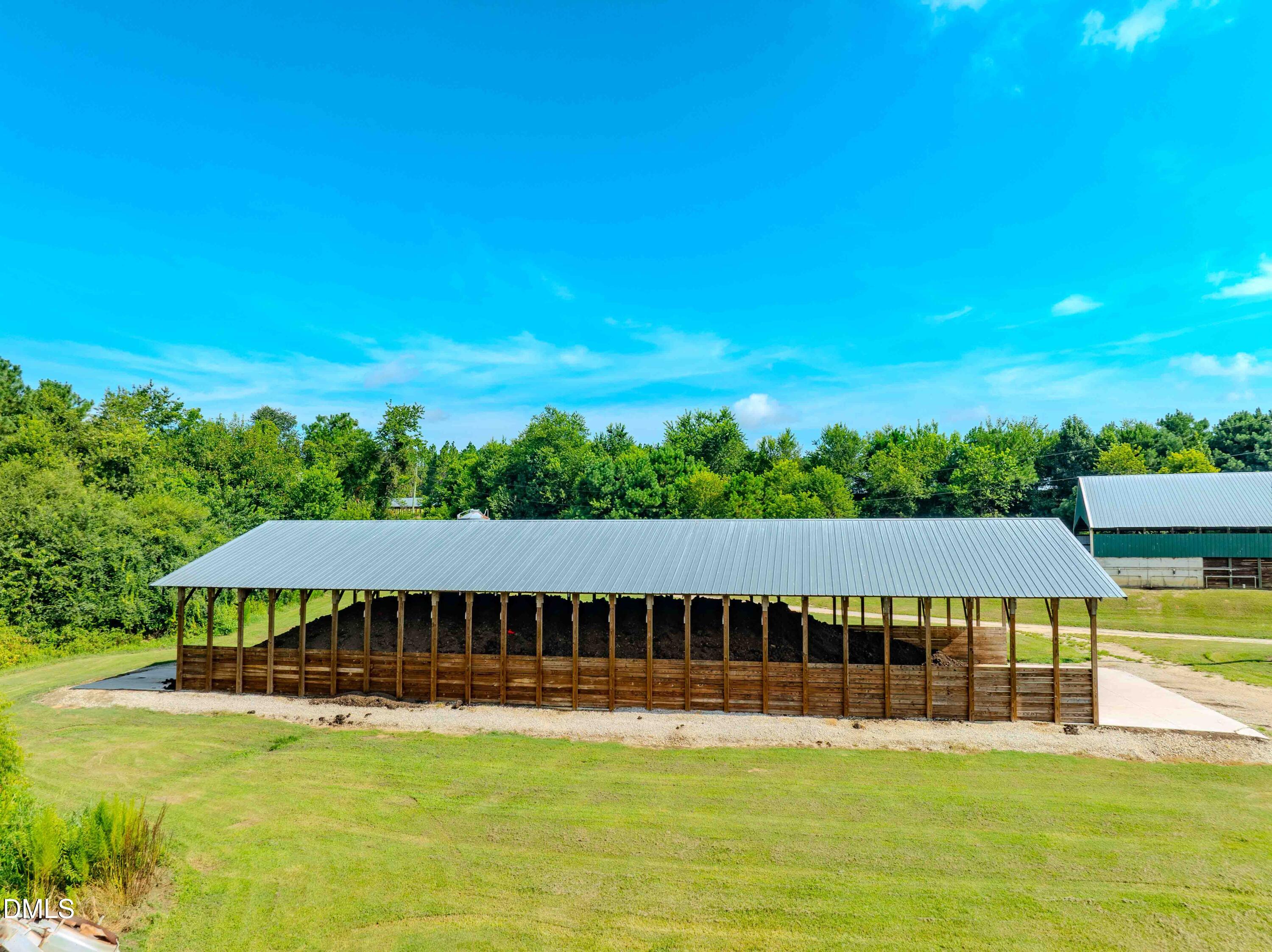 687 Brock Road Bunnlevel, NC 28323 - Photo 65 of 68 a view of swimming pool with lawn chairs and large trees