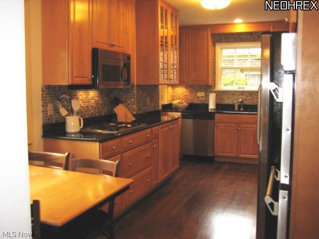 3326 Daleford Road Cleveland, OH 44120 - Photo 10 of 23 Welcome to the awesome updated eat-in Kitchen with hardwood floors. maple cabinets and so much more.