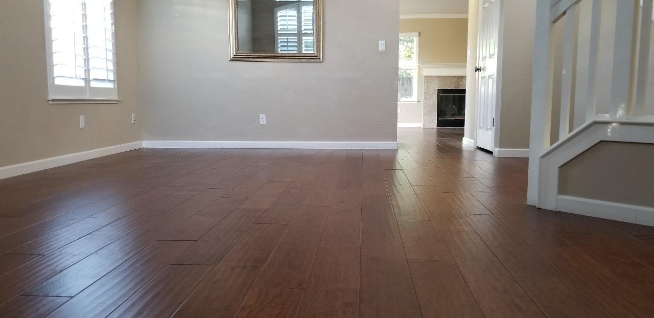 4592 Fallstone Court San Jose, CA 95124 - Photo 2 of 13 an empty room with wooden floor and windows