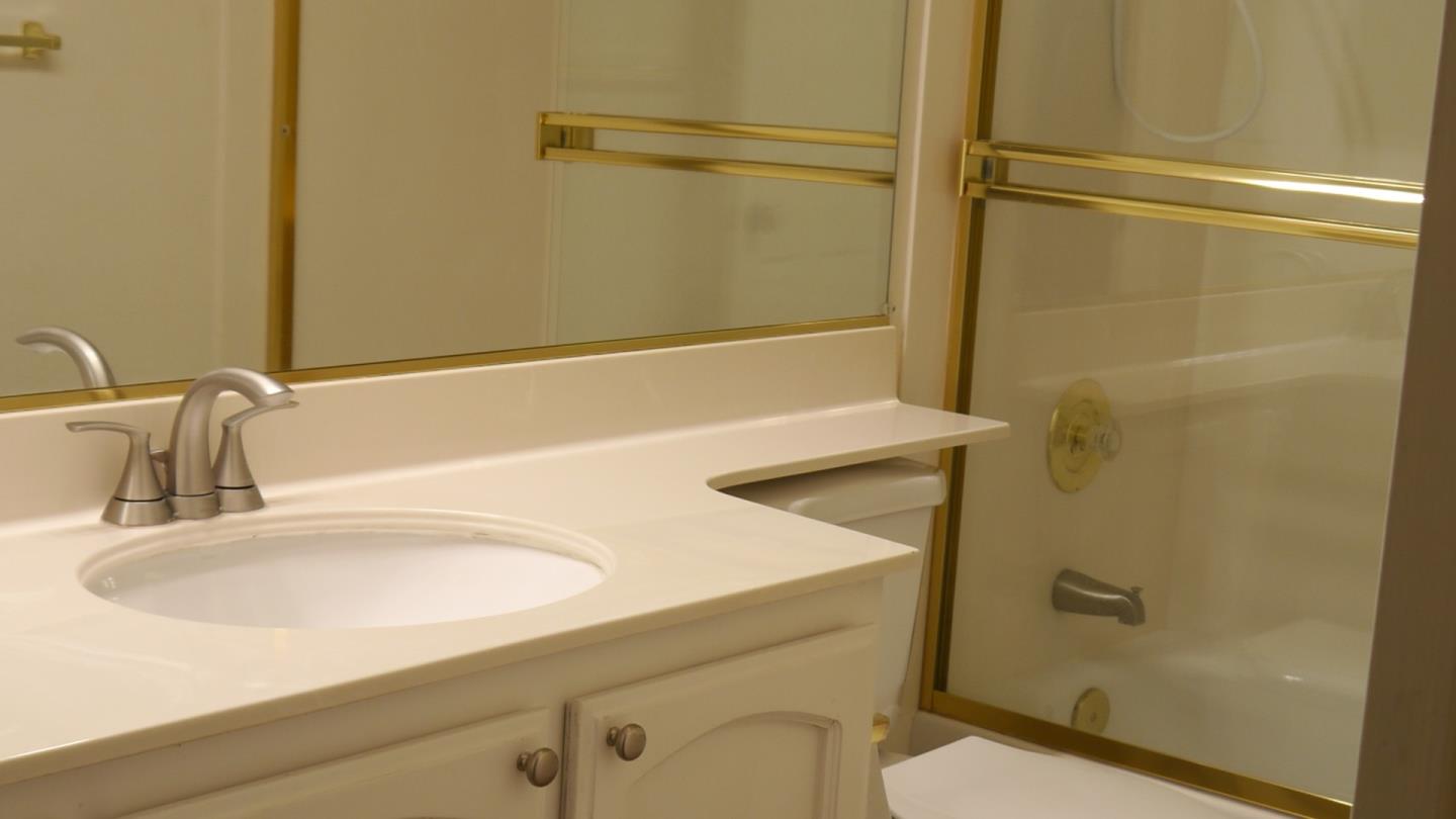 4592 Fallstone Court San Jose, CA 95124 - Photo 11 of 13 a bathroom with a sink and a shower