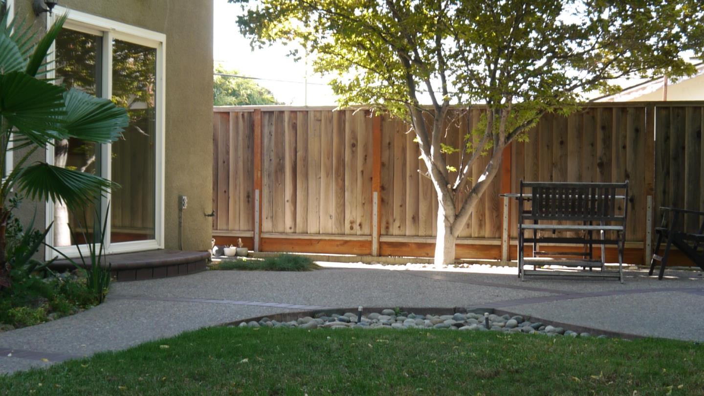 4592 Fallstone Court San Jose, CA 95124 - Photo 12 of 13 a backyard of a house with lots of green space and fountain