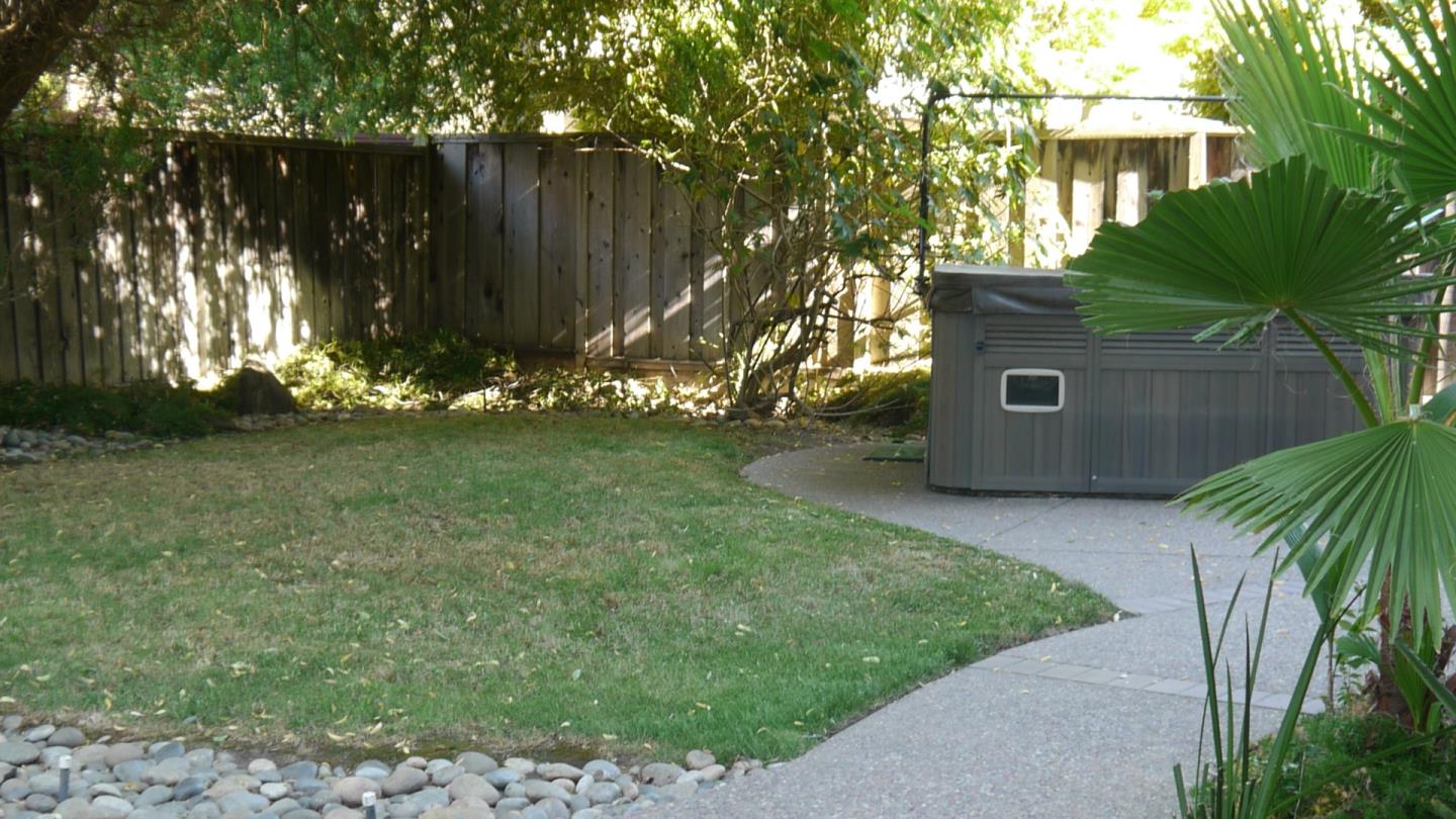 4592 Fallstone Court San Jose, CA 95124 - Photo 13 of 13 a backyard of a house with a garden and plants
