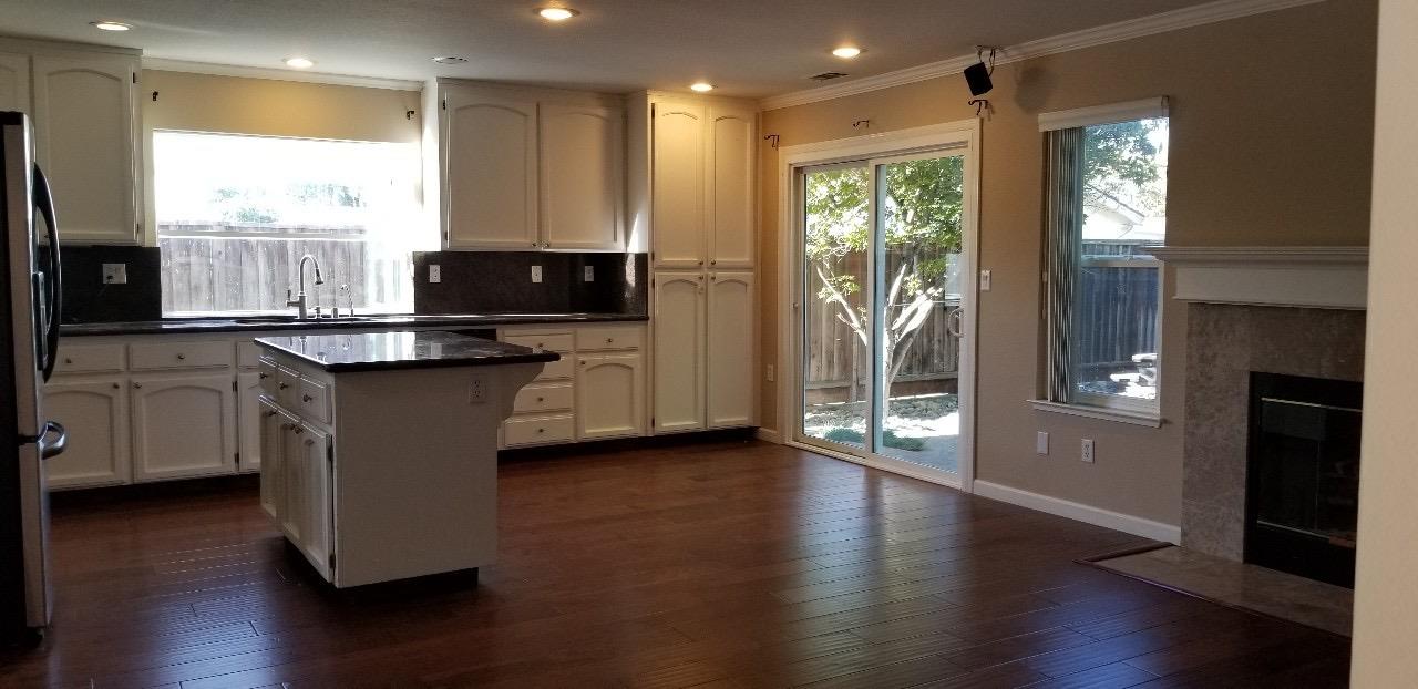 4592 Fallstone Court San Jose, CA 95124 - Photo 5 of 13 a kitchen with stainless steel appliances granite countertop a stove a sink and a microwave