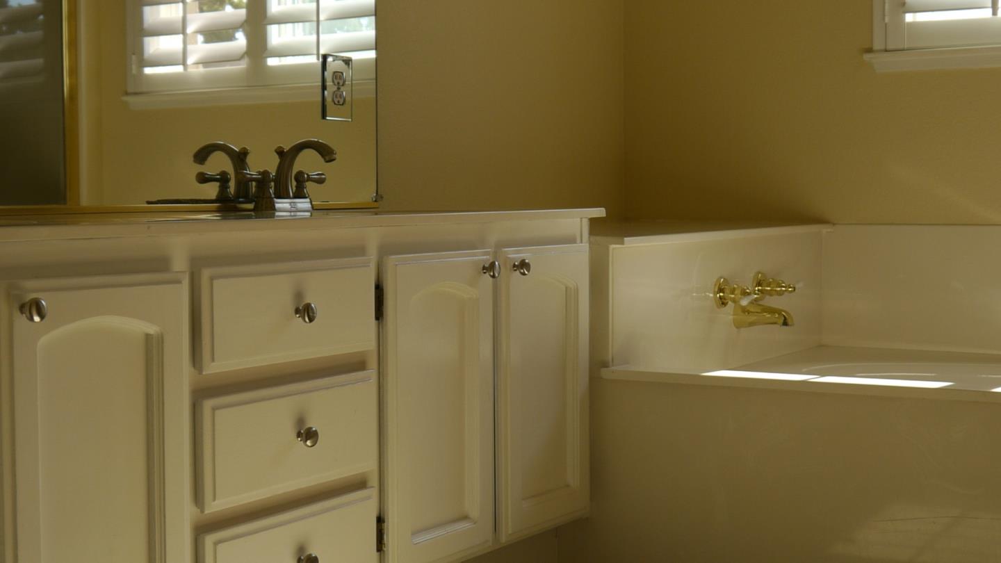 4592 Fallstone Court San Jose, CA 95124 - Photo 8 of 13 a bathroom with a shower