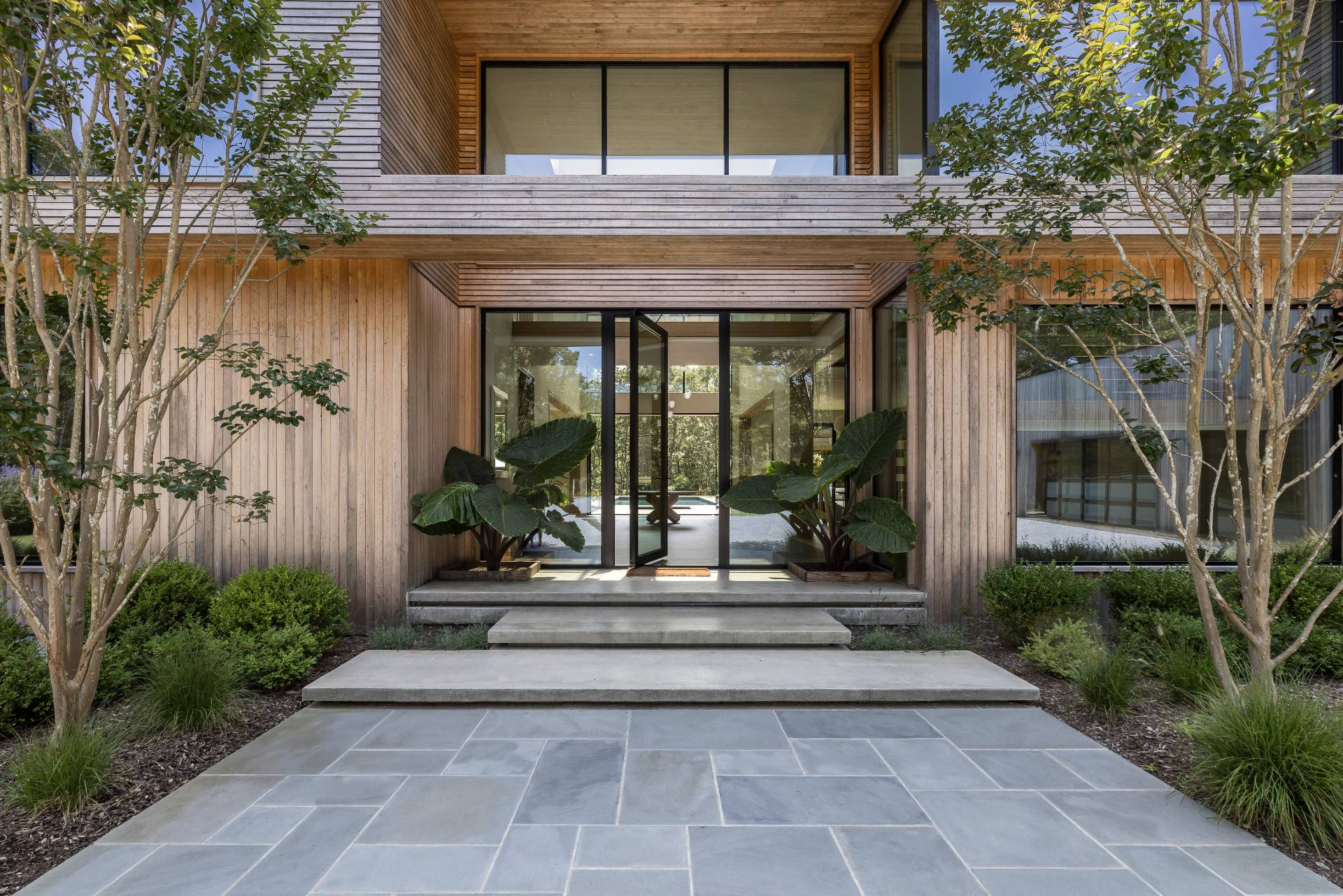 a view of a brick building with a bench in front of house