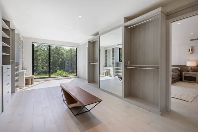 a bathroom with a double vanity sink mirror and shower