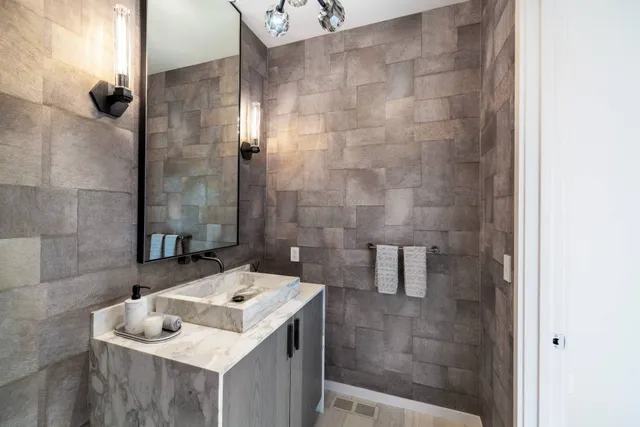 a living room with furniture pool and a flat screen tv
