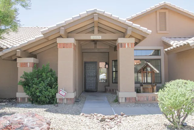 a view of a balcony with a floor to ceiling window and wooden floor