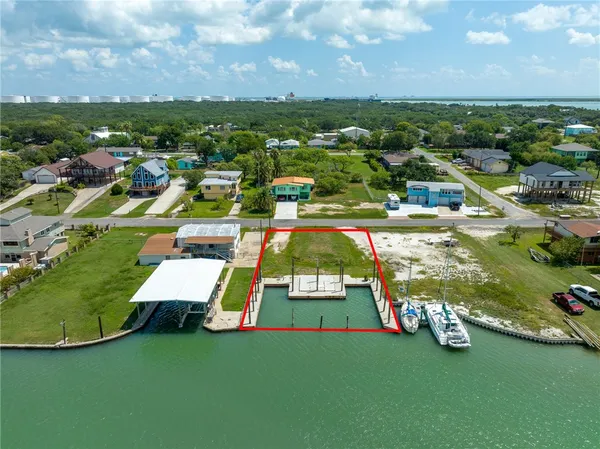 an aerial view of a house with a big yard