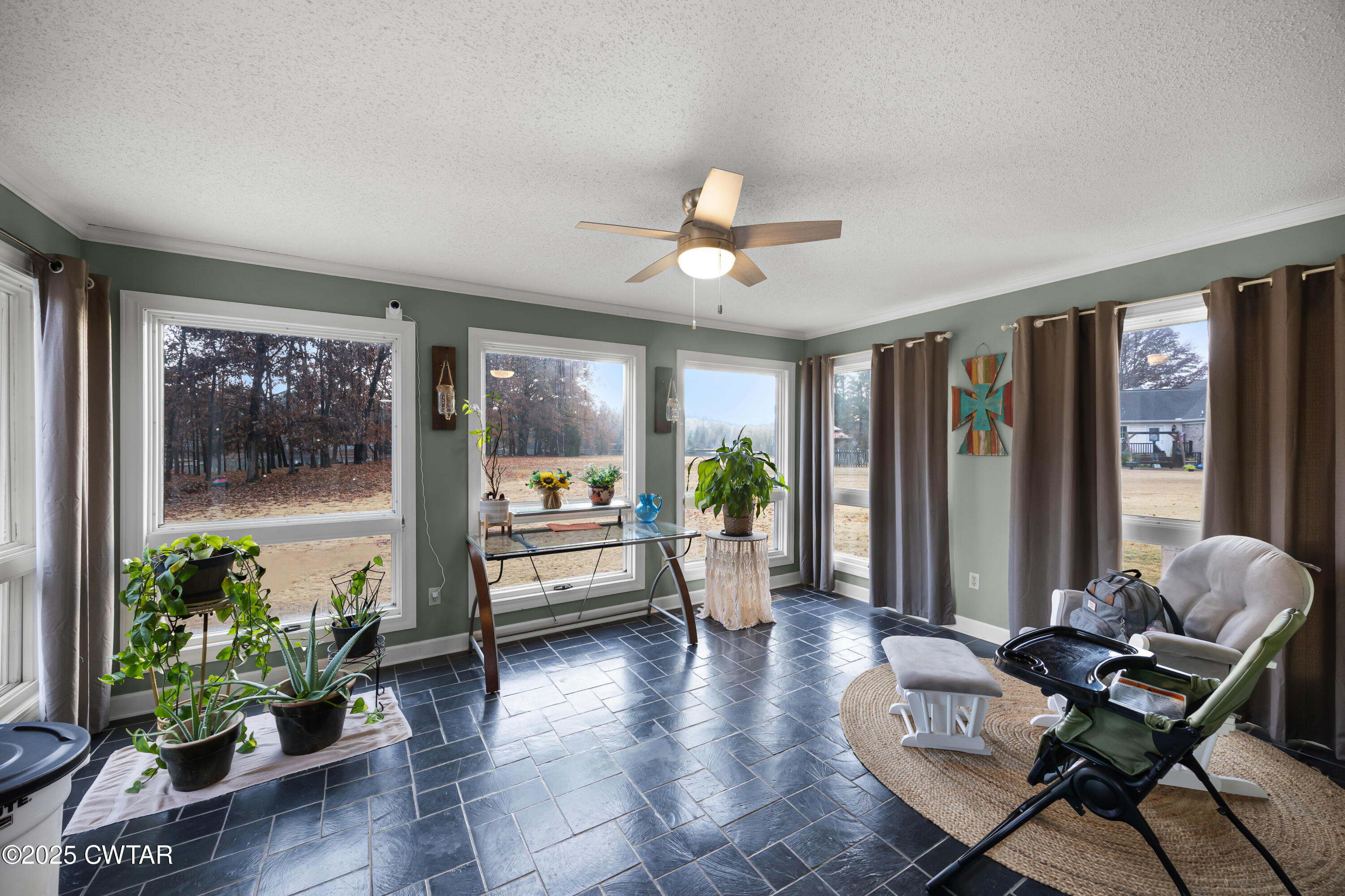 185 Bascom Road Jackson, TN 38305 - Photo 12 of 28 a living room with furniture and a large window with wooden floor
