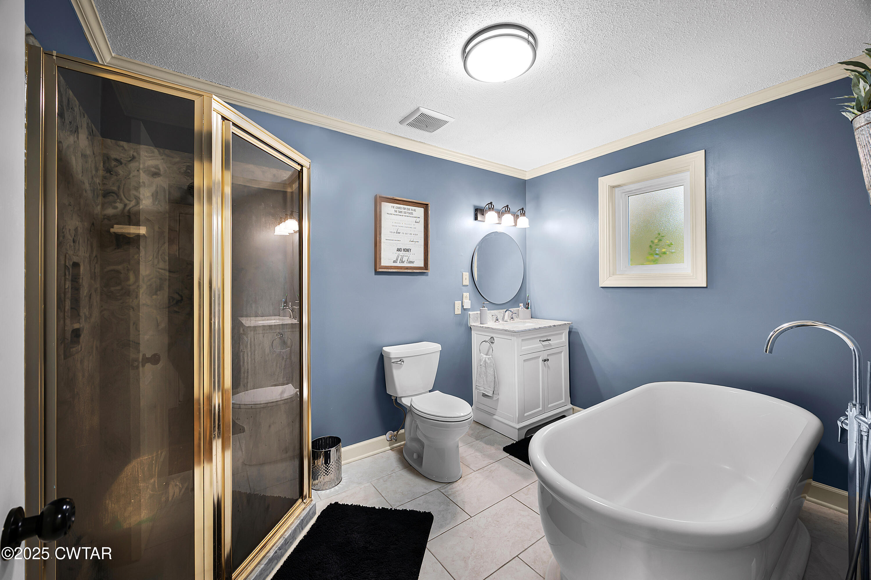 185 Bascom Road Jackson, TN 38305 - Photo 15 of 28 a bathroom with a toilet sink and mirror