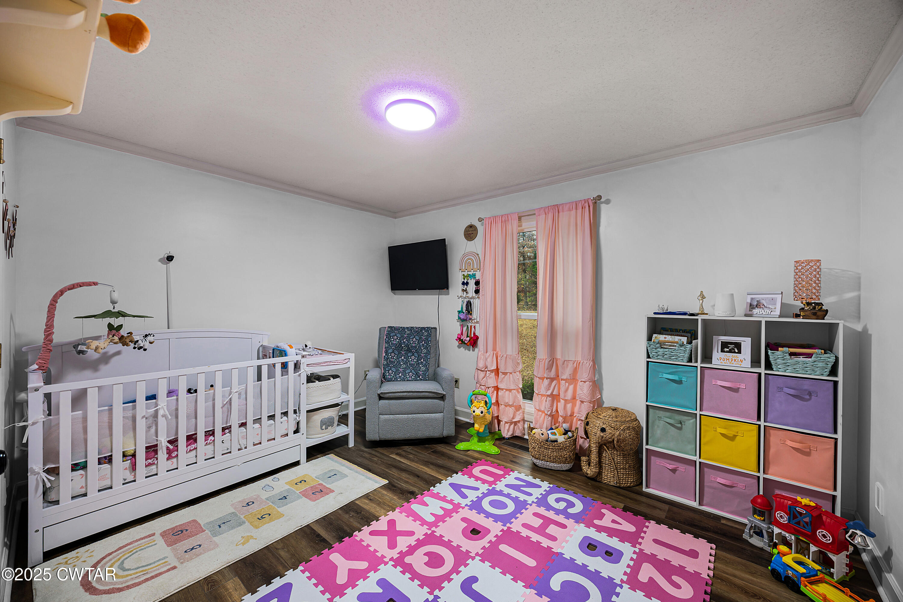 185 Bascom Road Jackson, TN 38305 - Photo 18 of 28 a bedroom with furniture and baby crib