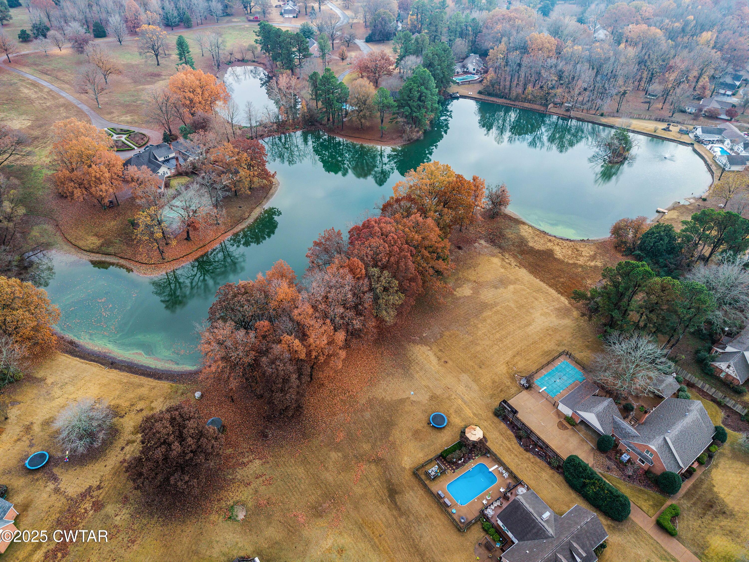 185 Bascom Road Jackson, TN 38305 - Photo 2 of 28 an aerial view of a house with a lake view