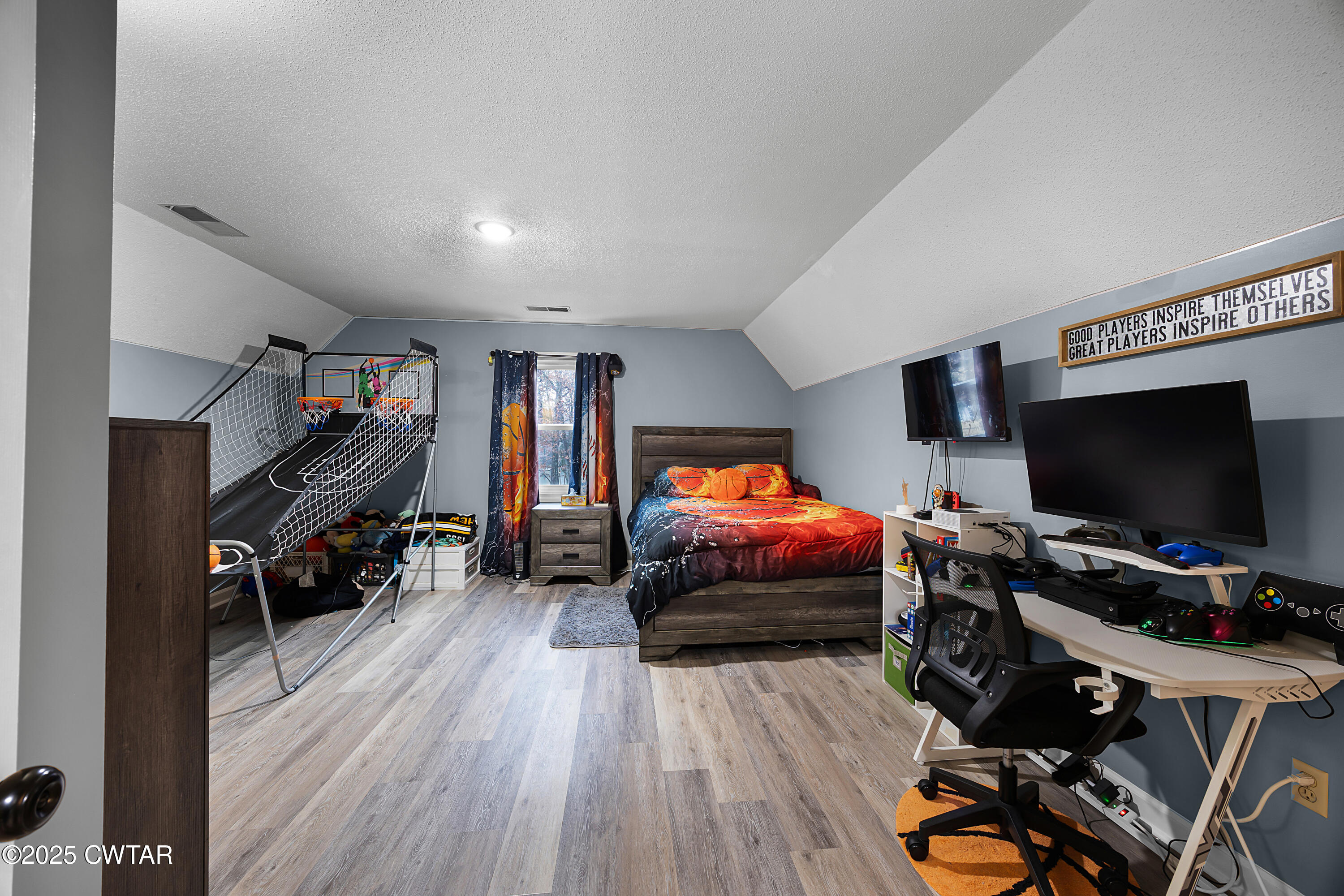 185 Bascom Road Jackson, TN 38305 - Photo 21 of 28 a bedroom with furniture and a flat screen tv