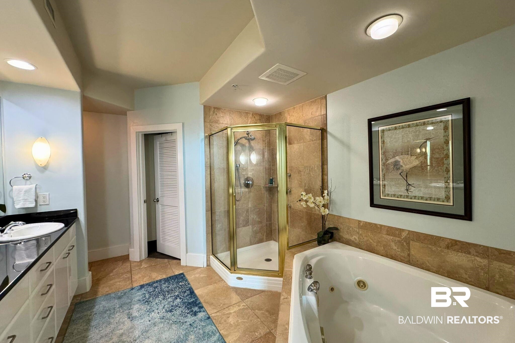 28107 Perdido Beach Boulevard, Unit D714 Orange Beach, AL 36561 - Photo 30 of 88 Full bath featuring visible vents, a stall shower, vanity, tile patterned flooring, and a tub with jets