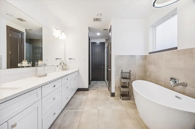 a bathroom with a glass shower door