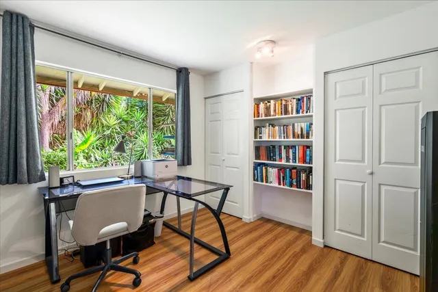 a workspace with lounge chair and a window