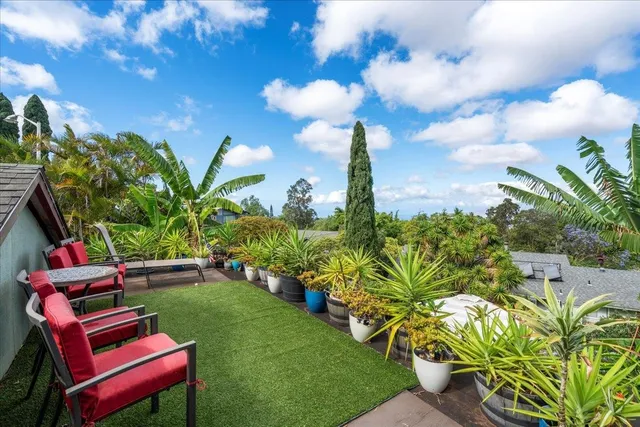 a view of a yard with chairs