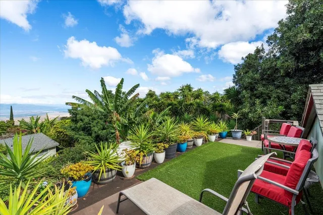 a view of a golf course with chairs