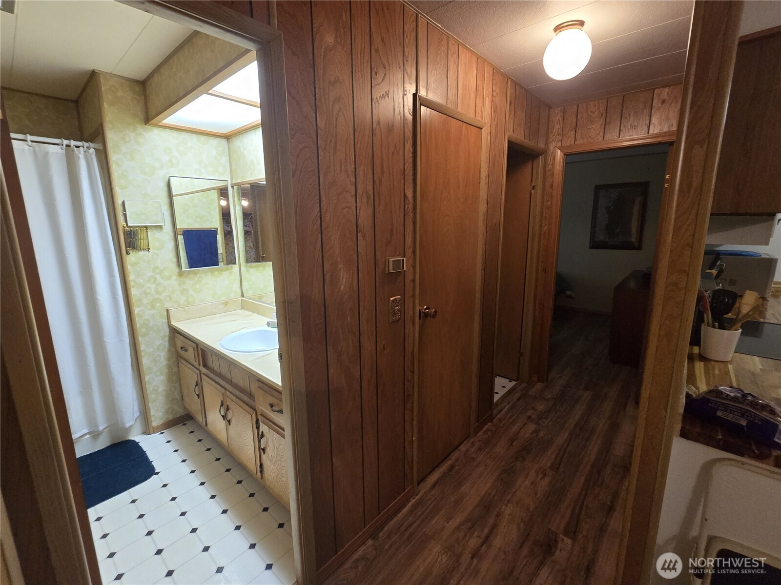600 Russell Road Forks, WA 98331 - Photo 13 of 31 a bathroom with a sink a mirror and a shower