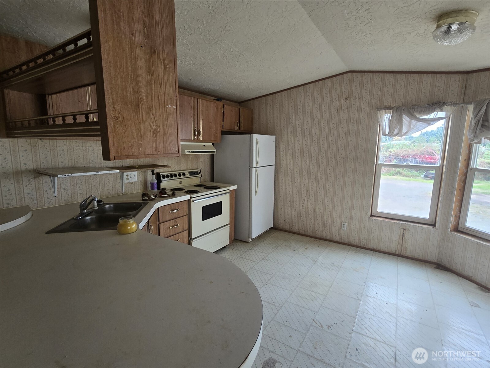 600 Russell Road Forks, WA 98331 - Photo 27 of 31 a kitchen with refrigerator and window
