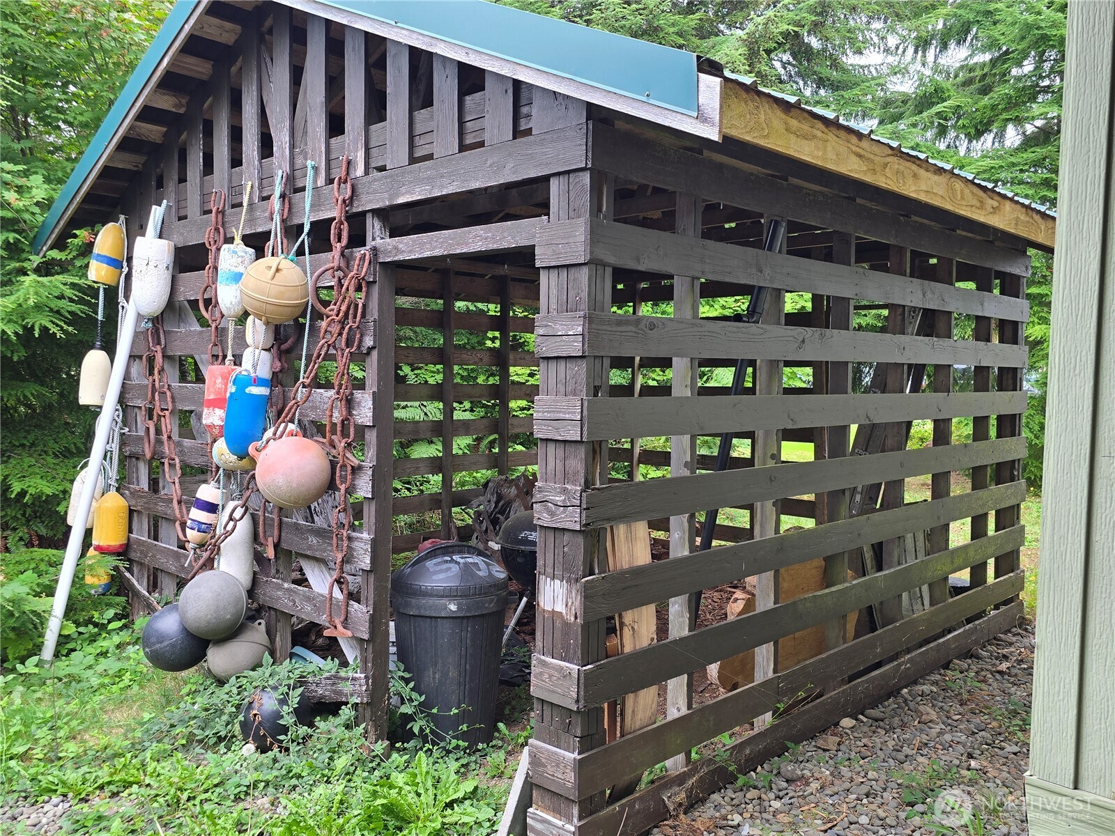600 Russell Road Forks, WA 98331 - Photo 6 of 31 a backyard of a house with seating space and trees in the background