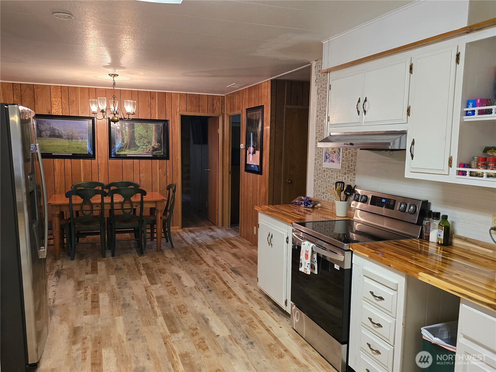 600 Russell Road Forks, WA 98331 - Photo 10 of 31 a kitchen with stainless steel appliances granite countertop a stove and a refrigerator